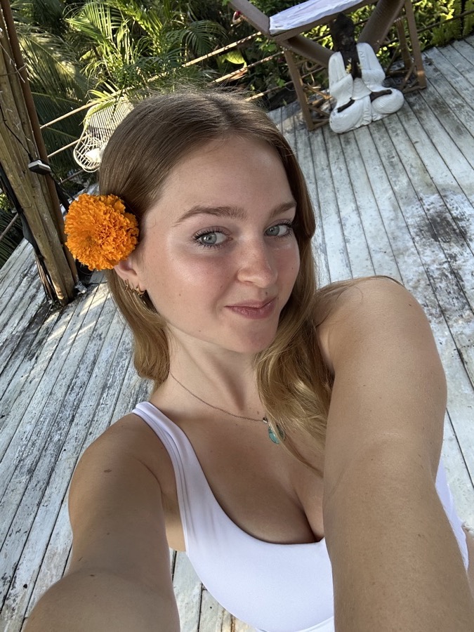 Carmen with an orange flower in her hair